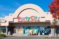 Party City retail chain store exterior. Nobody has more party for less slogan of facade.
