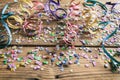 Colorful carnival confetti and serpentines on wooden background Royalty Free Stock Photo