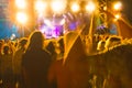 Crowd raising their hands and enjoying great festival party or concert.