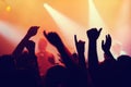 Party, concert and hands of people in audience or crowd with energy for dance event at night. Music, light and festival Royalty Free Stock Photo