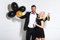 Party couple with balloons and champagne. Royalty Free Stock Photo