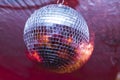 Party with disco ball with red lights Royalty Free Stock Photo