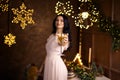 woman in beautiful dress with glass of sparkling wine over Christmas lights Royalty Free Stock Photo