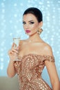 Party, drinks, holidays, people and celebration concept - smiling woman in evening dress with glass of sparkling wine over Royalty Free Stock Photo