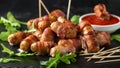 Party finger food pigs in blankets on toothpicks with ketchup sauce and wild rocket leaves Royalty Free Stock Photo