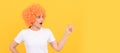 Party fun wig. look over there. amazed fancy party look. freaky woman in clown wig pointing finger, copy space. Woman Royalty Free Stock Photo