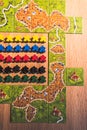A party game called Carcassonne. is played on a wooden table. Zeewolde flevoland the netherlands 9 feb 2020