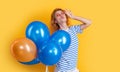 party girl with balloon in sunglasses. positive girl hold party balloons in studio.