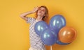 party girl with balloon in sunglasses. positive girl hold party balloons in studio.