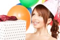 Party girl with balloons and gift box Royalty Free Stock Photo