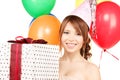 Party girl with balloons and gift box Royalty Free Stock Photo