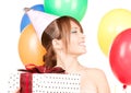 Party girl with balloons and gift box Royalty Free Stock Photo