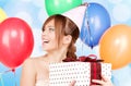 Party girl with balloons and gift box Royalty Free Stock Photo