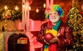 Party goer. new year weekend. Fanily holiday. xmas gifts. Time for presents. party man in clown wig. happy man with