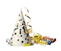 Party hat, blowers and confetti streamers on white background Royalty Free Stock Photo