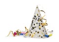 Party hat, blowers and confetti streamers on white background Royalty Free Stock Photo