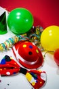 Party hat with bow, balloons and streamers Royalty Free Stock Photo