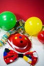 Party hat with bow, balloons and streamers, oblique photo Royalty Free Stock Photo