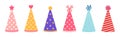 Party hat vector icon set. Colorful caps for birthday, festival, carnival, event. Cones with polka dots, stripes, stars, hearts. Royalty Free Stock Photo