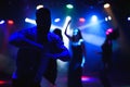 party, holidays, celebration, nightlife and people concept - group of happy friends dancing in night club Royalty Free Stock Photo
