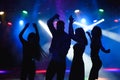 party, holidays, celebration, nightlife and people concept - group of happy friends dancing in night club. Royalty Free Stock Photo