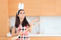 Easter Cook with Bunny Ears and Huge Wooden Spoon Royalty Free Stock Photo