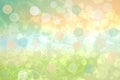 Party invitation background. Abstract pastel blue green yellow orange texture with blurred bokeh lights and soft color circles. Royalty Free Stock Photo