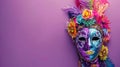Banner with colorful mardi gras or carnivale mask and accessories over purple background.