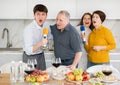 Party and karaoke at house for fun social event or gathering together in celebration. Happy family singing song using Royalty Free Stock Photo