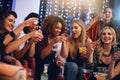 Party, nightclub and friends with alcohol shots for birthday celebration, ladies night and social event. Cheers, toast