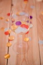 Party over background empty wine glass confetti Royalty Free Stock Photo