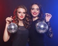 Party and people concept: Party girls with disco balls Royalty Free Stock Photo