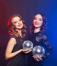 party and people concept: Party girls with disco balls Royalty Free Stock Photo