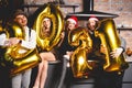 Party, people and new year holidays concept - women and men celebrating new years eve 2021.