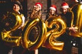 Party, people and new year holidays concept - women and men celebrating new years eve 2021. Royalty Free Stock Photo