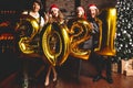 Party, people and new year holidays concept - women and men celebrating new years eve 2021. Royalty Free Stock Photo