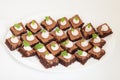 Party platter with small chocolate cakes Royalty Free Stock Photo