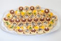 Party platter with small cupcakes with different stuffing. Food catering Royalty Free Stock Photo