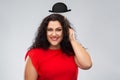 Happy woman in red dress with black bowler hat Royalty Free Stock Photo