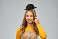 Smiling teenage girl with black vintage bowler hat Royalty Free Stock Photo