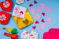 Party set of colorful balloons, origami paper hearts, envelopes onblue background. valentine day set Royalty Free Stock Photo