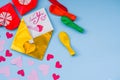 Party set of colorful balloons, origami paper hearts, envelopes onblue background. valentine day set Royalty Free Stock Photo