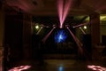 party stage in dark with lights and silhouettes Royalty Free Stock Photo