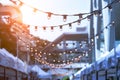 Party string lights hanging in a line on street in Bangkok, Thai