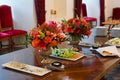 Party table setting decorated with flower bouquets, catering Royalty Free Stock Photo