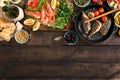 Party table with shrimp, fish grilled, salad, snacks, white wine