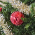 Party tinsel and red glittery ornament on festive holiday Christ