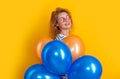 party woman with balloon in sunglasses. positive woman hold party balloons in studio.