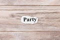 PARTY of the word on paper. concept. Words of PARTY on a wooden background