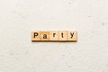 PARTY word written on wood block. PARTY text on cement table for your desing, concept Royalty Free Stock Photo